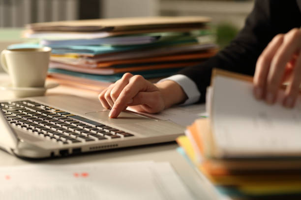 istock Executive hands working hard late hours in the night 1216081578
