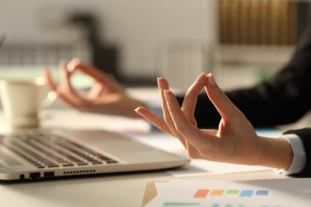 istock Executive hands relieving stress doing yoga at night 1216081595