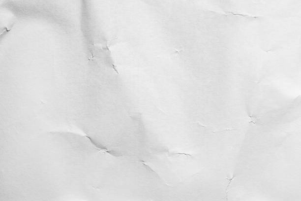 istock Crumpled and shabby empty white paper texture background. 1216081863
