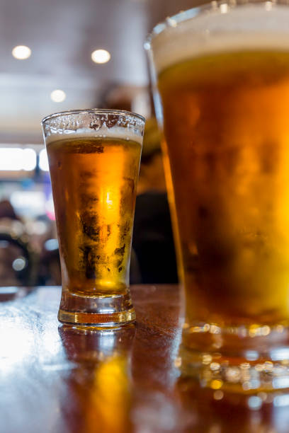 istock Glasses of light beer on the table 1216084709