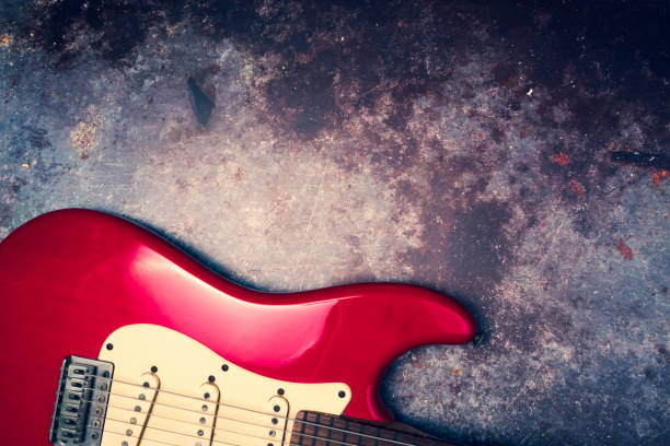 A Red Electric Guitar On A Grunge Background Stock Photo - Download Image  Now - Guitar, Backgrounds, Broadcasting - iStock