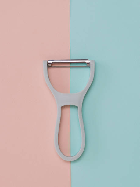 istock A gray peeler with a plastic handle on a two-color background. 1216086709