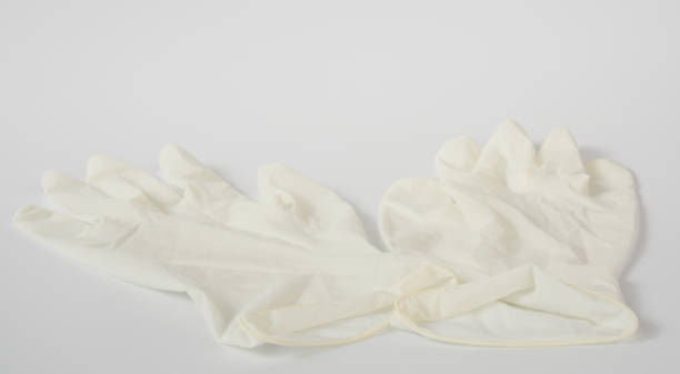 istock Sterilized surgical latex doctor gloves on white background 1216086839