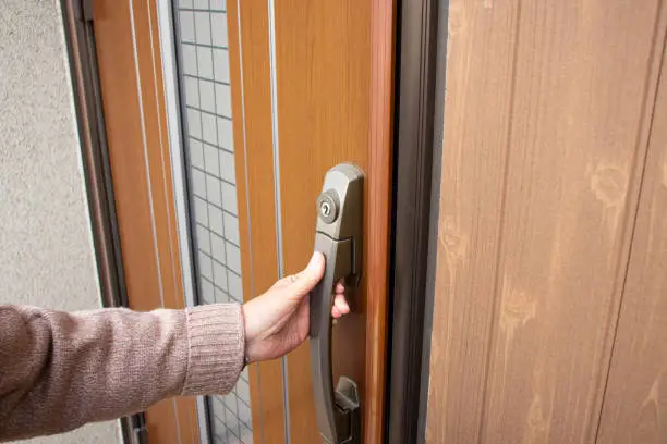 Elderly woman having a front door.