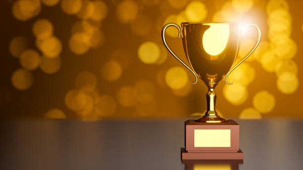 istock 3D Rendering . Gold Trophy and dark background bokeh. 1216087683