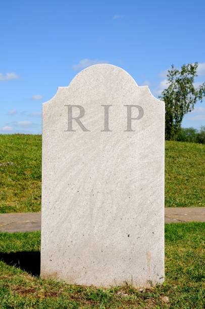 istock Plain grey textured tombstone with the letters RIP 1216092511