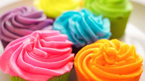 istock Colorful cupcakes, desserts, cream, butter and milk, Selective focus 1216094407