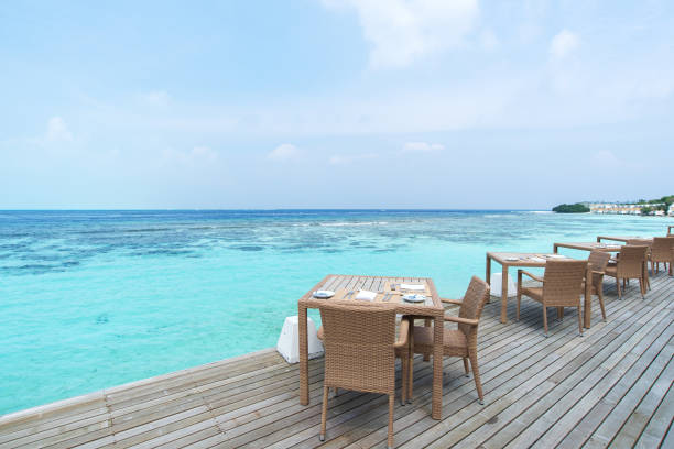 istock Open air restaurant beside tropical lagoon 1216094770