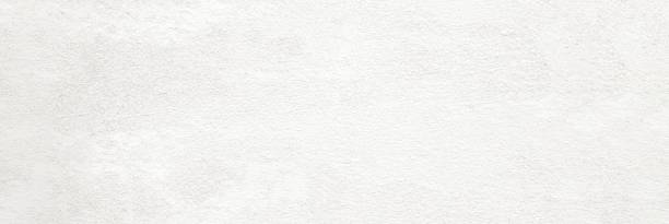 istock White concrete stone paint wall background, Grunge cement paint texture backdrop, Light brown rough concrete stone wall banner, Copy space for interior design background, wallpaper 1216098232