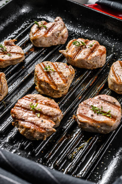 istock Tender boneless grilled pork chops. steak tenderloin. gray background. Top view 1216100108