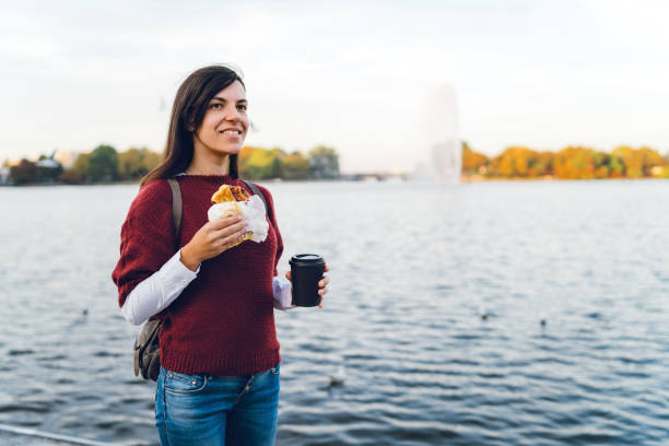 Young tourist woman is relaxing at Binnenalster Lake Hamburg, Germany.