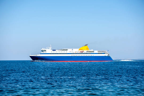 istock Big blue ferry boat floating on Aegean sea under a clear blue sky. Greece 1216101537