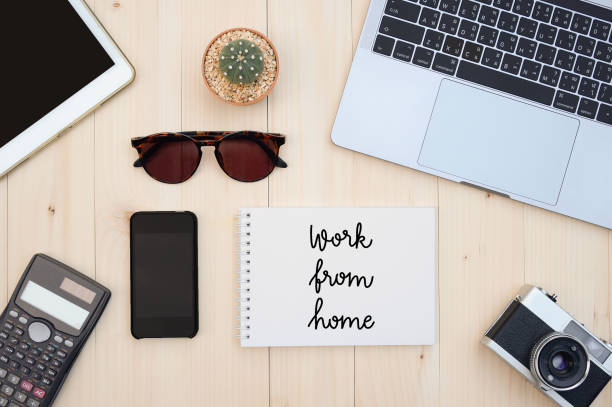 istock Work from home hand drawn lettering with flat lay of accessories 1216103811