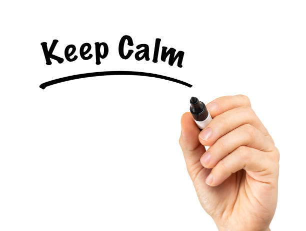istock Male hand writing Keep Calm isolated on white board 1216104106