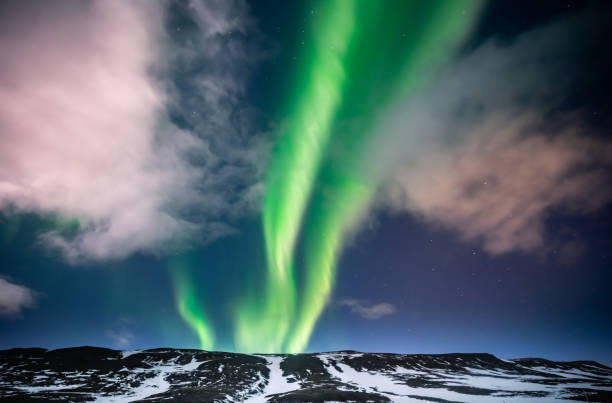 istock Northern lights aurora borealis over mountains 1216106757