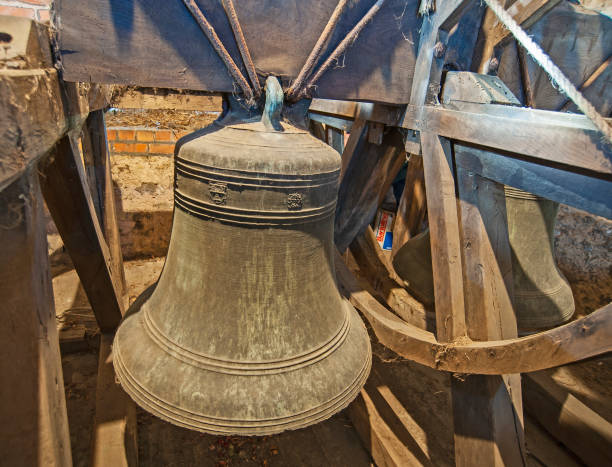 istock Large old bells in a church tower 1216107050