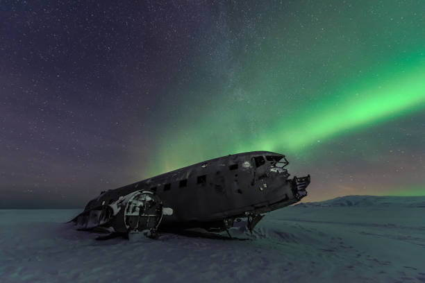 istock Northern lights over plane wreckage in Iceland 1216107082
