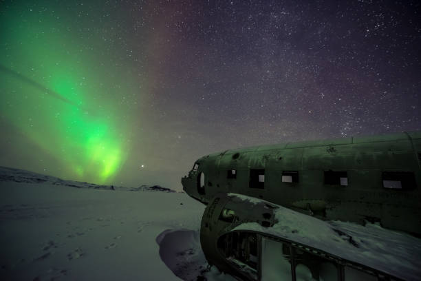 istock Northern lights over plane wreckage in Iceland 1216107089