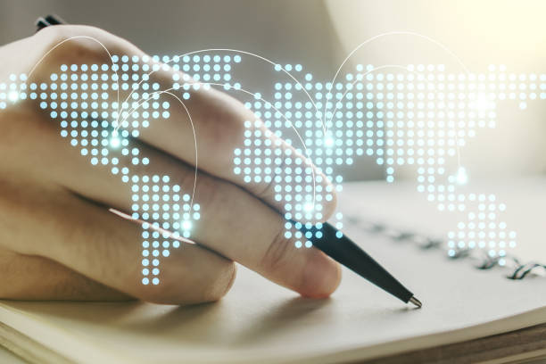 istock Abstract creative world map with connections and man hand writing in notebook on background, international trading concept. Multiexposure 1216107884
