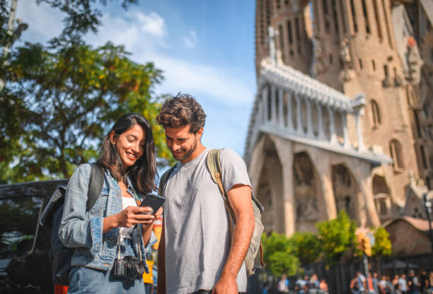istock Couple Checking Smart Phone for Directions in Barcelona 1216113140