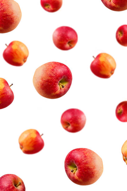 istock Falling ripe red apples background. Isolated. Close-up. 1216113559