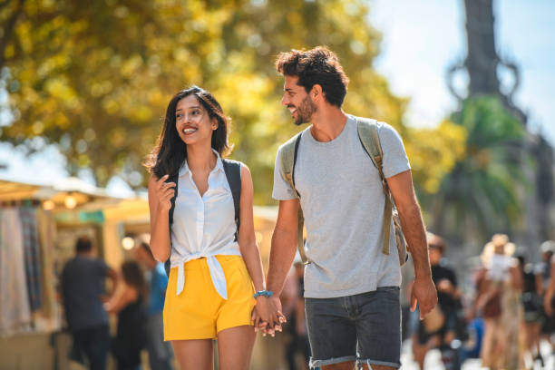 istock Relaxed Young Tourists Walking on The Ramblas in Barcelona 1216114630