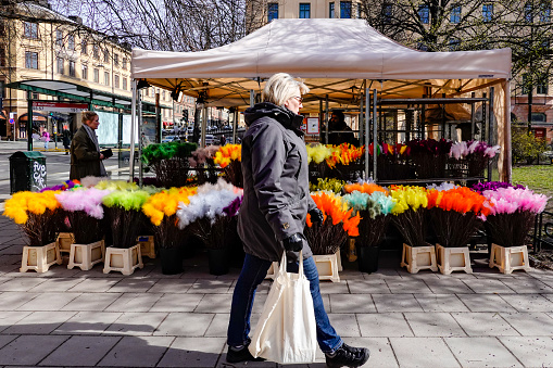 Stockholm, Sweden March 31, 2020 Despite lock downs in all other countries, people in the Swedish capital are still more or less going about their normal business but the streets are noticeably emptier than usual. Pedestrians at Mariatorget.