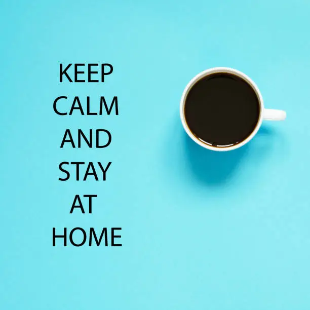 Photo of Keep calm and stay at home. Self isolation and quarantine campaign to protect yourself and save lives. Flat lay cup of black coffee. - Image