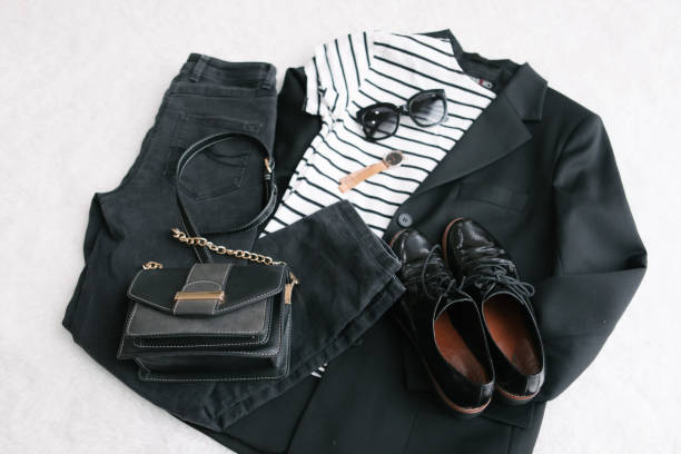 istock overhead flat lay view woman clothes black and white 1216124462