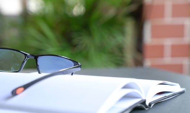 istock Reading glasses on top of an open book. Copy space. 1216124606