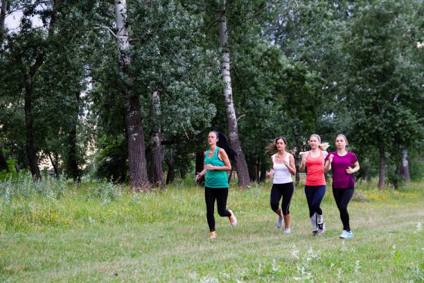 istock Group of women jogging together 1216125513