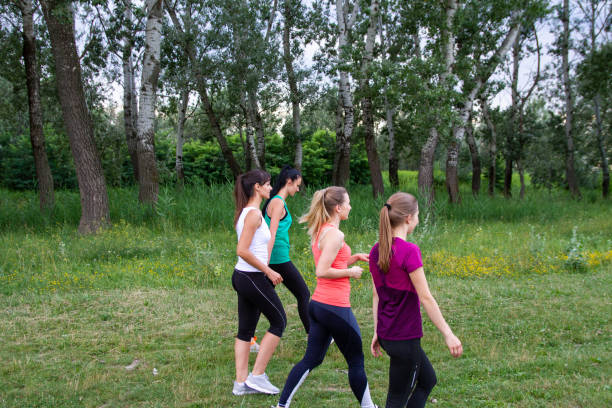 istock Female runners walking along forest 1216126577