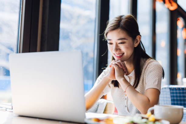 istock Asian woman working laptop at cafe. 1216128621
