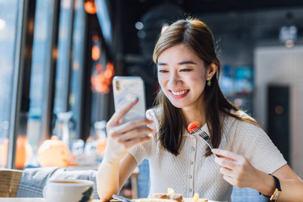 istock Asian Businesswoman using mobile phone. 1216128793