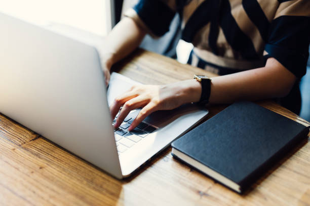 istock Asian woman working laptop at cafe. 1216129399