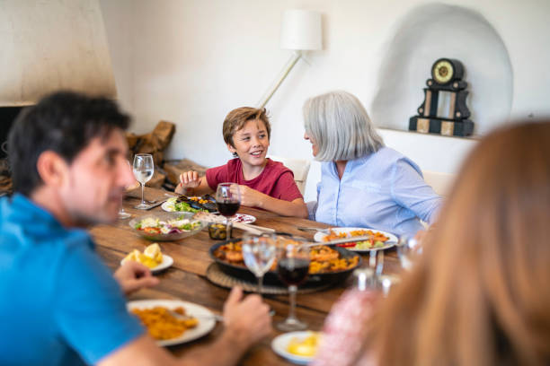 istock Grandmother and Grandson Conversing During Midday Meal 1216130044