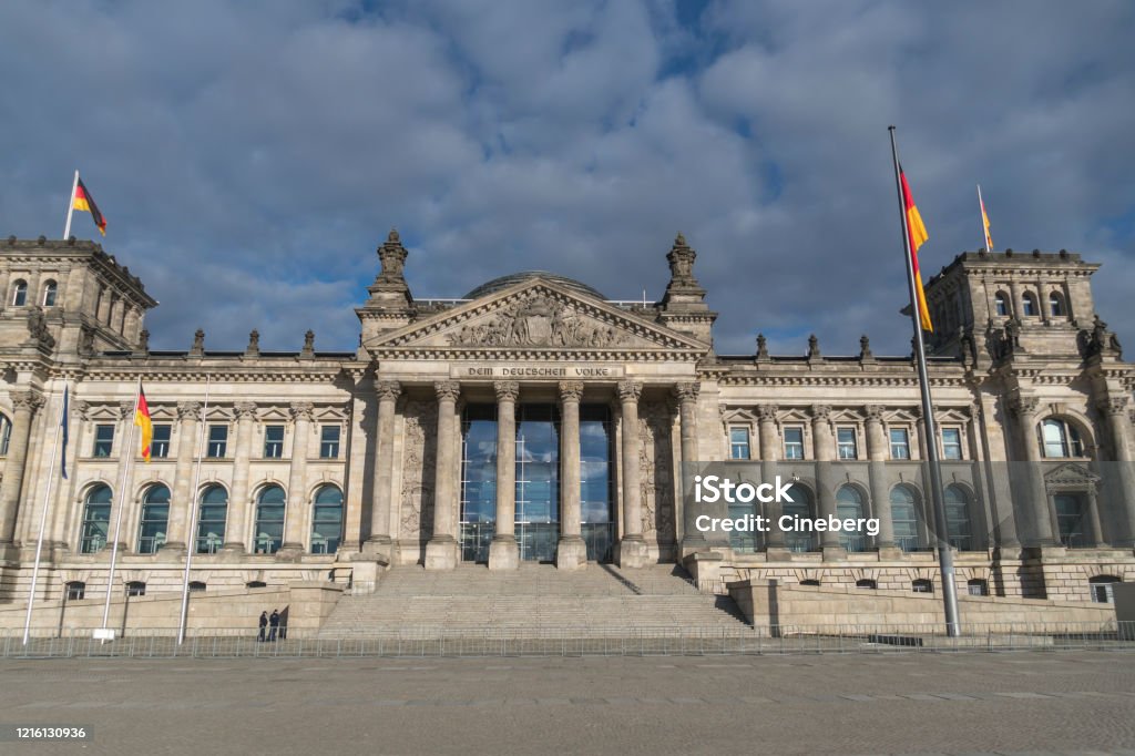 German Bundestag, Berlin Facade of the Berlin Reichstag building seen from Platz der Republik, the former Königsplatz, during the city's lockdown due to the COVID-19 spreading Architectural Column Stock Photo