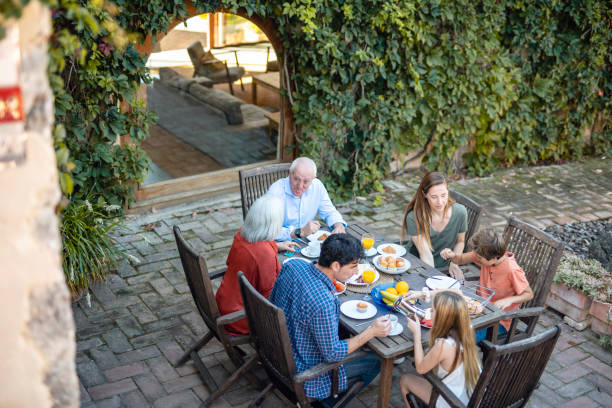 istock Multi-Generation Family Enjoying Outdoor Breakfast at Home 1216131166