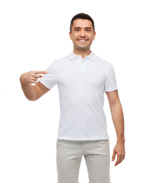 smiling man in t-shirt pointing finger on himself
