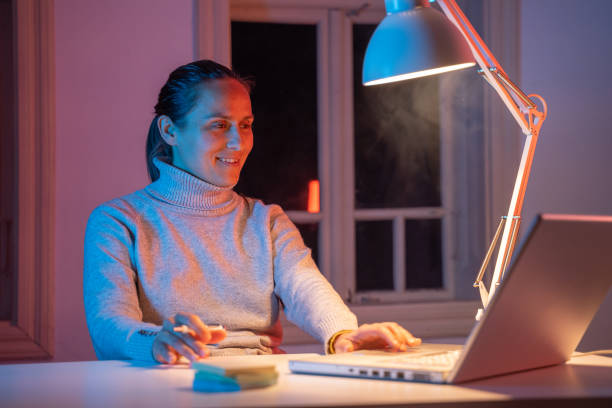 istock Young professional working at home, late at night. COVID-19 quarantine. 1216135275