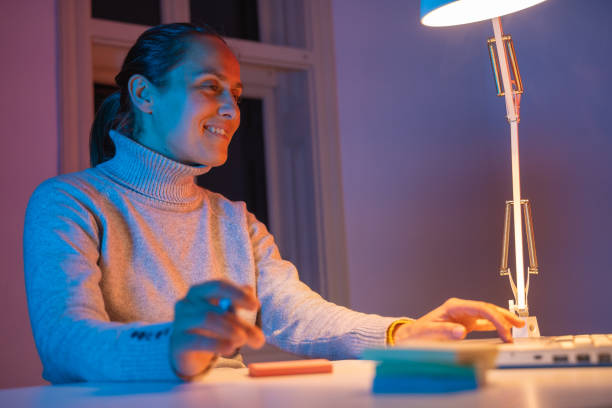 istock Young professional working at home, late at night. COVID-19 quarantine. 1216135309