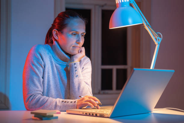 istock Young professional working at home, late at night. COVID-19 quarantine. 1216135338