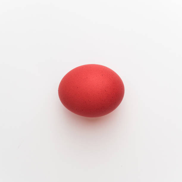 istock Red chicken easter egg molecule. Minimal virus or coronavirus outbreak holiday concept. White background 1216135673