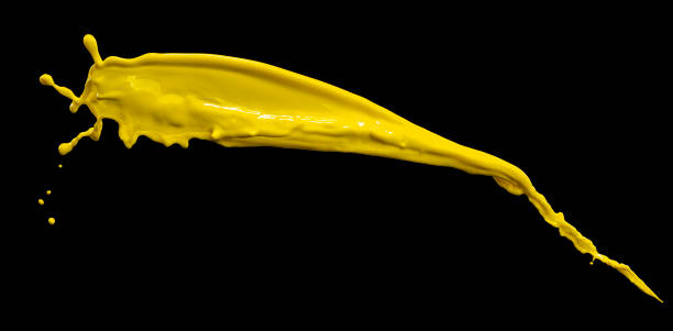 istock splendid yellow paint splash isolated on black background 1216136643