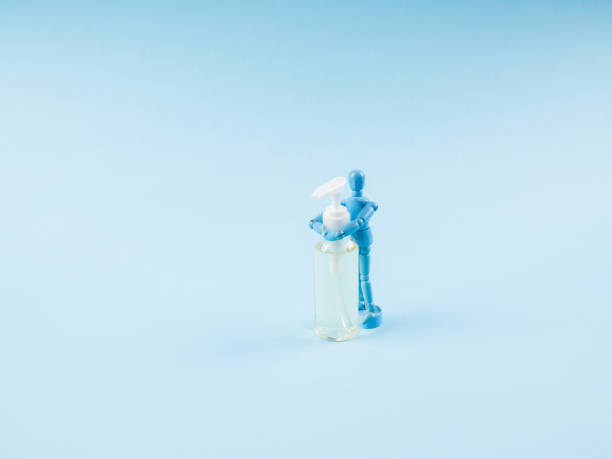 istock Puppet hugging sanitizer gel. Mysophobia, Covid-19 1216137399