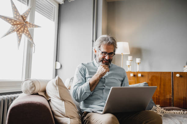 istock Mature man is working from home 1216138685