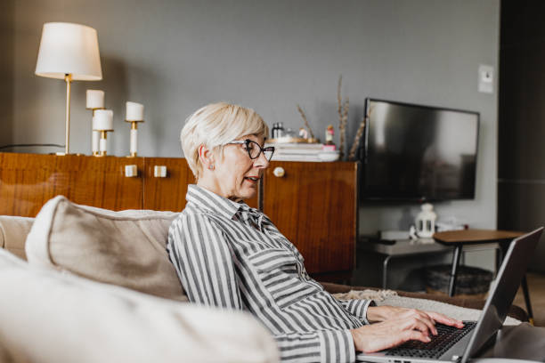 istock Mature woman is working from home 1216139227