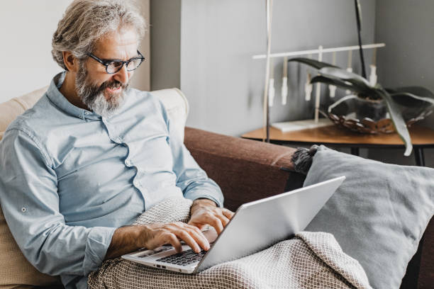 istock Mature man is working from home 1216139234