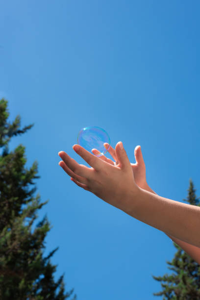 istock A bubble soap in children hands 1216139817