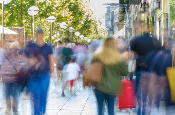 istock Blurred people walking on busy city sidewalk 1216144249